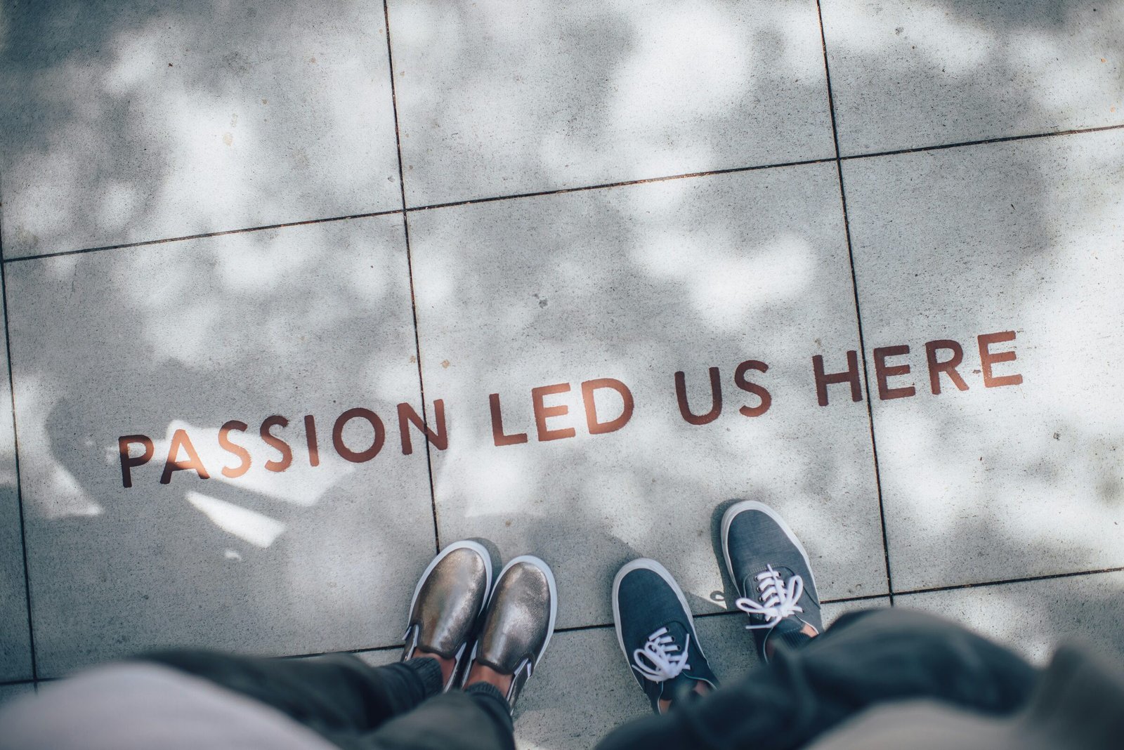 Passion led us here — pavement lettering symbolising brand meaning beyond the product